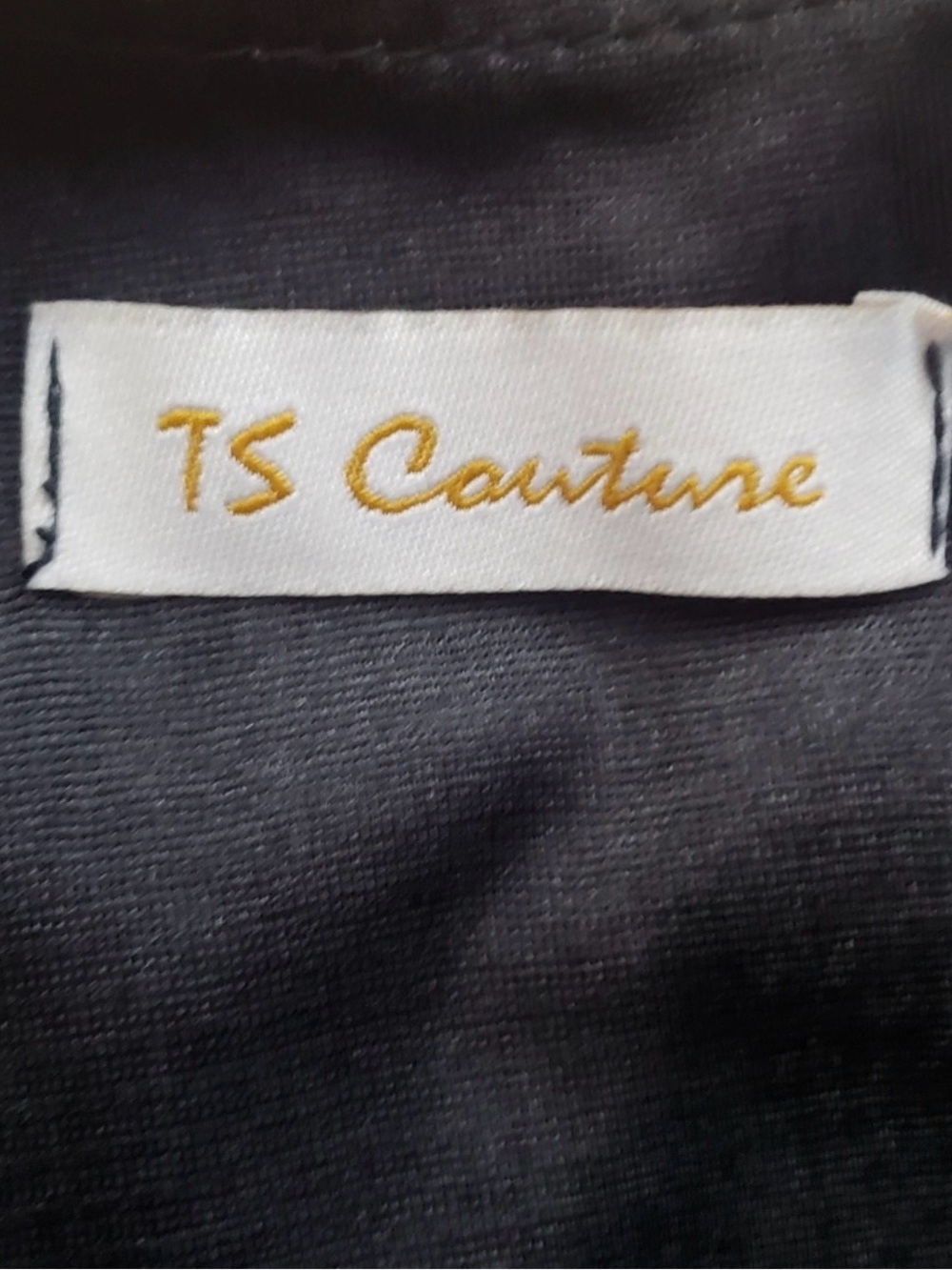 TS Couture black jumpsuit with Gold Logo Tag
New with tags